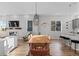 Modern dining area with light wood table and stylish chairs at 1415 W 68Th Ave, Denver, CO 80221