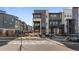 Modern three-story townhome with gray and white exterior at 1415 W 68Th Ave, Denver, CO 80221