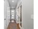 Bright hallway with access to bedrooms and other rooms at 1415 W 68Th Ave, Denver, CO 80221