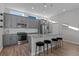 Modern kitchen with gray cabinetry, granite countertops and island at 1415 W 68Th Ave, Denver, CO 80221