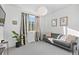 Cozy living room featuring a gray sofa and stylish decor at 1415 W 68Th Ave, Denver, CO 80221