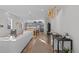 Sun-filled living room with hardwood floors, modern lighting, and an open concept floor plan at 1415 W 68Th Ave, Denver, CO 80221