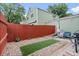 The backyard features a decorative rock garden, red fencing, and outdoor seating at 8997 W 88Th Ave, Westminster, CO 80021