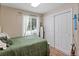 Cozy bedroom with natural light, featuring a comfortable bed and ample closet space at 8997 W 88Th Ave, Westminster, CO 80021