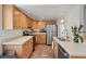 Efficient kitchen featuring stainless steel appliances and light wood cabinetry, perfect for home cooking at 8997 W 88Th Ave, Westminster, CO 80021