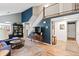 Bright living room featuring a vaulted ceiling, a staircase to the second floor and hardwood style floors at 8997 W 88Th Ave, Westminster, CO 80021