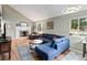 Inviting living room with a fireplace, bright windows, stylish furniture, decor and hardwood style floors at 8997 W 88Th Ave, Westminster, CO 80021