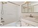 Bathroom featuring shower-tub combo and modern vanity at 1885 S Quebec Way # A16, Denver, CO 80231