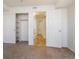 Bedroom features neutral carpet, white walls, closet, and an ensuite bathroom at 1885 S Quebec Way # A16, Denver, CO 80231