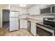 Modern kitchen with stainless steel appliances and stylish countertops at 1885 S Quebec Way # A16, Denver, CO 80231