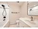 Clean bathroom with tub, shower, and updated vanity at 13577 W Alaska Dr, Lakewood, CO 80228