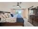 Spacious bedroom with a king-size bed and access to a deck at 13577 W Alaska Dr, Lakewood, CO 80228