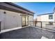Outdoor living space with modern design, stylish deck tiles, and sliding door access at 1412 Pierce St, Lakewood, CO 80214