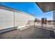A modern deck features clean lines, durable tiling, and a metal safety railing at 1412 Pierce St, Lakewood, CO 80214