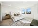 Bright main bedroom with an oversized window, recessed lighting, a cozy rug, and side tables at 1412 Pierce St, Lakewood, CO 80214