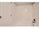Bright bathroom featuring a bathtub with white tile surround at 4281 S Salida Way # 8, Aurora, CO 80013
