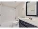 Bright bathroom featuring a bathtub, toilet, and dark vanity with sink at 4281 S Salida Way # 8, Aurora, CO 80013