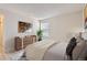 Well-lit bedroom featuring a dresser, window, and comfortable bed at 4281 S Salida Way # 8, Aurora, CO 80013