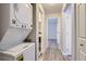 Hallway with stacked washer and dryer at 4281 S Salida Way # 8, Aurora, CO 80013