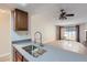 Well lit kitchen with stainless steel sink and view to the living room at 4281 S Salida Way # 8, Aurora, CO 80013