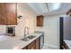 Galley kitchen features stainless steel appliances and stone countertops at 4281 S Salida Way # 8, Aurora, CO 80013