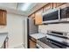 Efficient kitchen features stainless appliances and ample storage space at 4281 S Salida Way # 8, Aurora, CO 80013