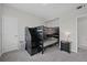 Bedroom featuring bunk beds with storage drawers and an ensuite bathroom at 12896 Ironstone Way # 203, Parker, CO 80134