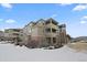 Attractive condo building with multiple balconies and well-maintained landscaping at 12896 Ironstone Way # 203, Parker, CO 80134