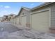 Row of garages with brick accents provide convenient parking for residents at 12896 Ironstone Way # 203, Parker, CO 80134