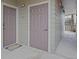 Apartment hallway with side-by-side doors and a 'Welcome' mat, leading to an outdoor staircase at 12896 Ironstone Way # 203, Parker, CO 80134