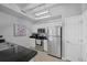 Clean kitchen design featuring stainless steel appliances, dark countertops, and tiled flooring at 12896 Ironstone Way # 203, Parker, CO 80134