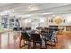 Community clubhouse with meeting room, fireplace, tables, and chairs for resident gatherings at 7455 E Quincy Ave # 204, Denver, CO 80237