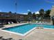 Community pool with lounge chairs, perfect for relaxation and recreation at 7455 E Quincy Ave # 204, Denver, CO 80237