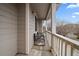 Comfortable balcony with chairs and a view of the nearby trees and neighborhood at 13023 Grant Cir # C, Thornton, CO 80241