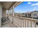 Relaxing balcony with outdoor seating and views of the neighborhood street at 13023 Grant Cir # C, Thornton, CO 80241