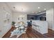 Stylish dining area featuring modern furniture, unique decor, and a view of the kitchen at 13023 Grant Cir # C, Thornton, CO 80241