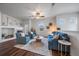 Cozy living room featuring a fireplace, stylish furniture, and ample natural light at 13023 Grant Cir # C, Thornton, CO 80241