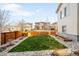 Beautiful backyard with green lawn and wood fence providing a private outdoor space at 11100 Pastel Pt, Parker, CO 80134
