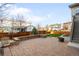 Well-maintained backyard featuring a brick patio, green lawn, and a wood fence for privacy at 11100 Pastel Pt, Parker, CO 80134