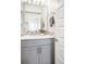 Modern bathroom features a sleek vanity, stylish mirror, and elegant tile accents for a luxurious feel at 11100 Pastel Pt, Parker, CO 80134