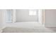 Spacious room with carpet and a window, perfect for a bedroom or a home office at 11100 Pastel Pt, Parker, CO 80134