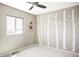 Bedroom boasts birch tree-inspired artwork, neutral walls, a ceiling fan, and two floating shelves at 11100 Pastel Pt, Parker, CO 80134