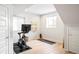 Bright exercise room with hardwood floors, natural light, and exercise equipment for a healthy lifestyle at 11100 Pastel Pt, Parker, CO 80134