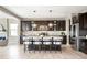 Modern kitchen featuring stainless steel appliances, granite countertops, an island with bar seating at 11100 Pastel Pt, Parker, CO 80134