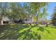 Spacious backyard featuring a large lawn area and patio at 11431 W Lake Dr, Littleton, CO 80127