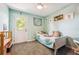 A charming room with an exterior door that brings in natural light, complemented by calming decor at 11431 W Lake Dr, Littleton, CO 80127