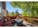 Spacious deck with an outdoor seating area and a fire pit with a beautiful view at 11431 W Lake Dr, Littleton, CO 80127