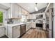 Modern kitchen featuring stainless steel appliances, white cabinets, and a subway tile backsplash, offering both style and functionality at 11431 W Lake Dr, Littleton, CO 80127
