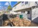 Townhome back porch and backyard enclosed with a wood fence at 3006 W 107Th Pl # D, Westminster, CO 80031