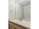 Simple bathroom with white sink, neutral countertop, and large mirror at 3006 W 107Th Pl # D, Westminster, CO 80031